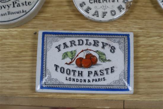 A collection of eighteen mainly black printed tooth,anchovy and other paste pot lids, including Yardley